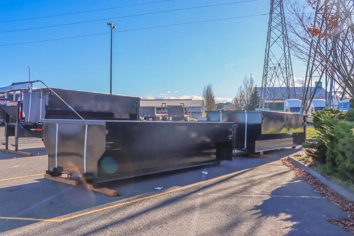 Roll-off dumpster ready for waste disposal at job site for 2 Yard Dumpster Rental in Florissant